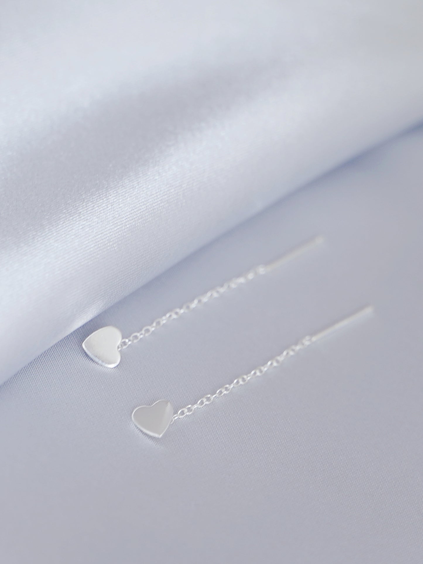 Heart threader dangle earrings with two heart charms and chain threads, silver tone