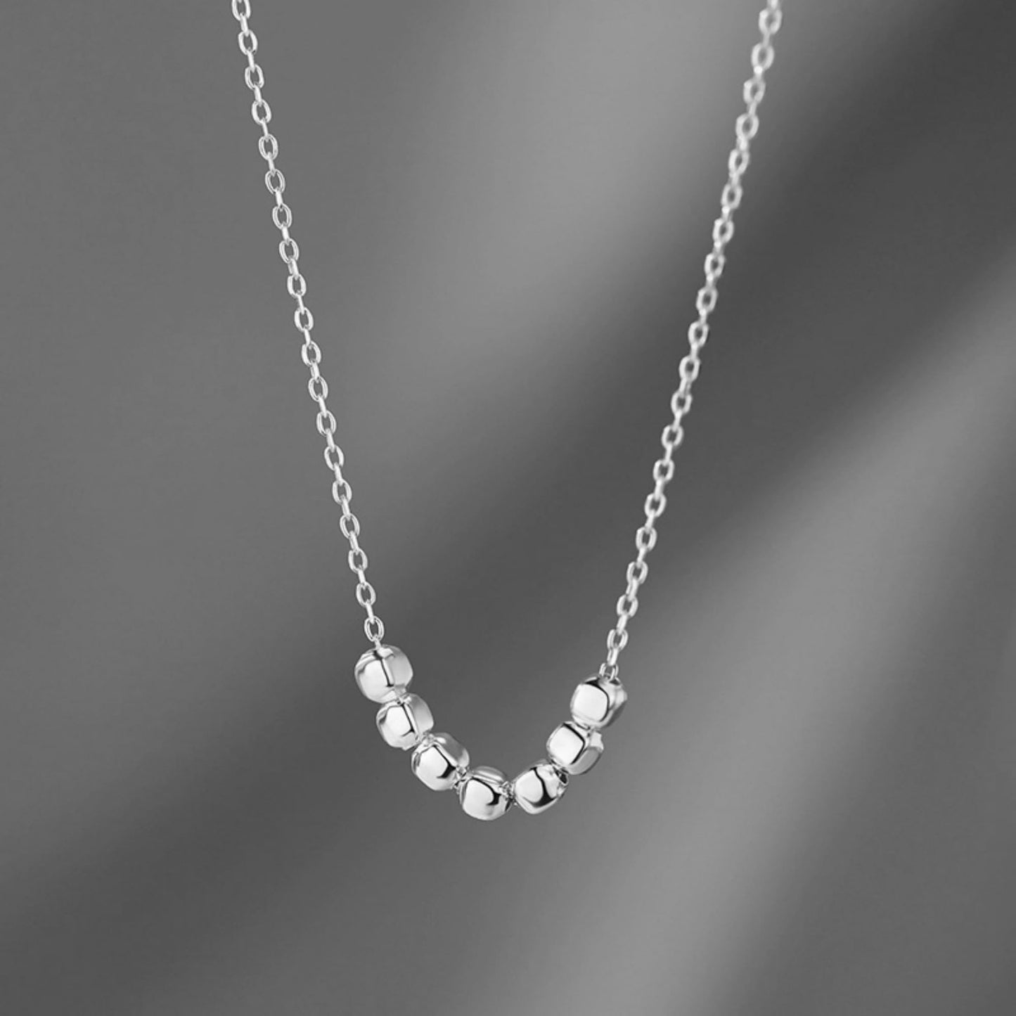 Silver-tone cube bead necklace on fine chain with evenly spaced cubes