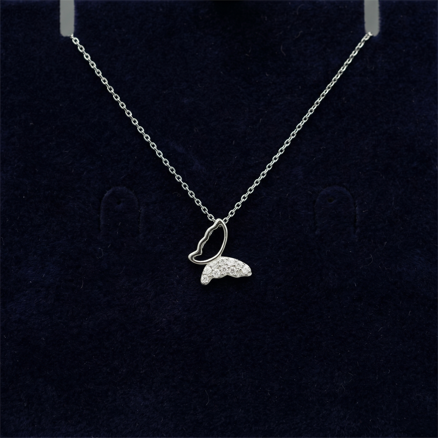 Silver-tone butterfly pendant necklace with heart-shaped outline and pave CZ butterfly charm