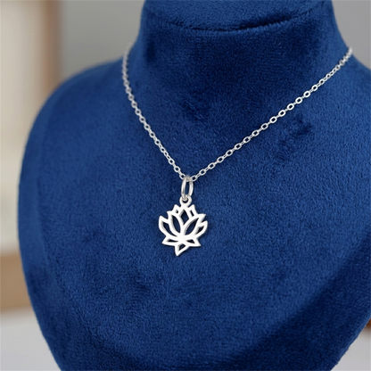 Silver-toned necklace with filigree lotus charm pendant on a fine chain