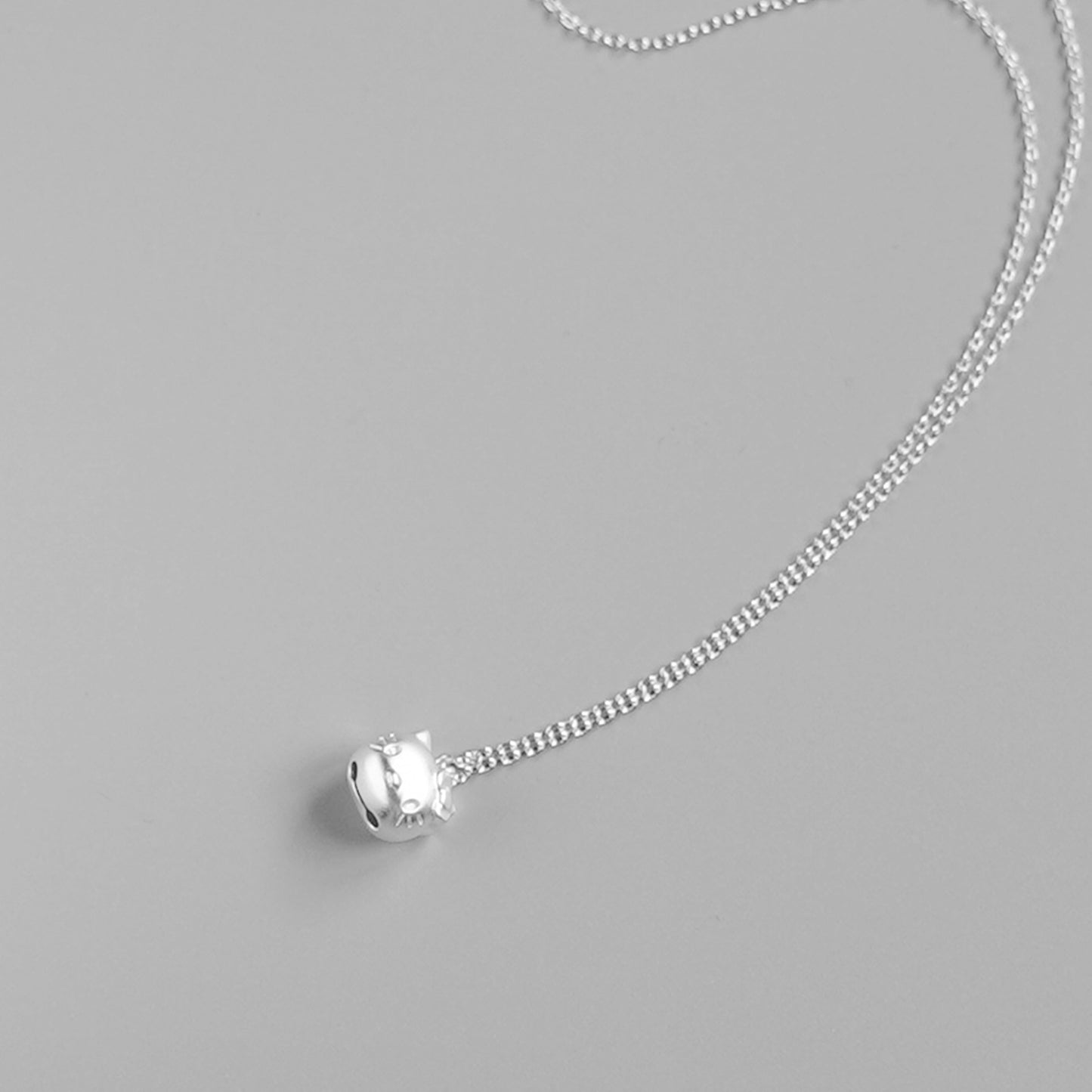 Sterling Silver Hello Kitty Necklace with Jingle Bell Charm - sugarkittenlondon