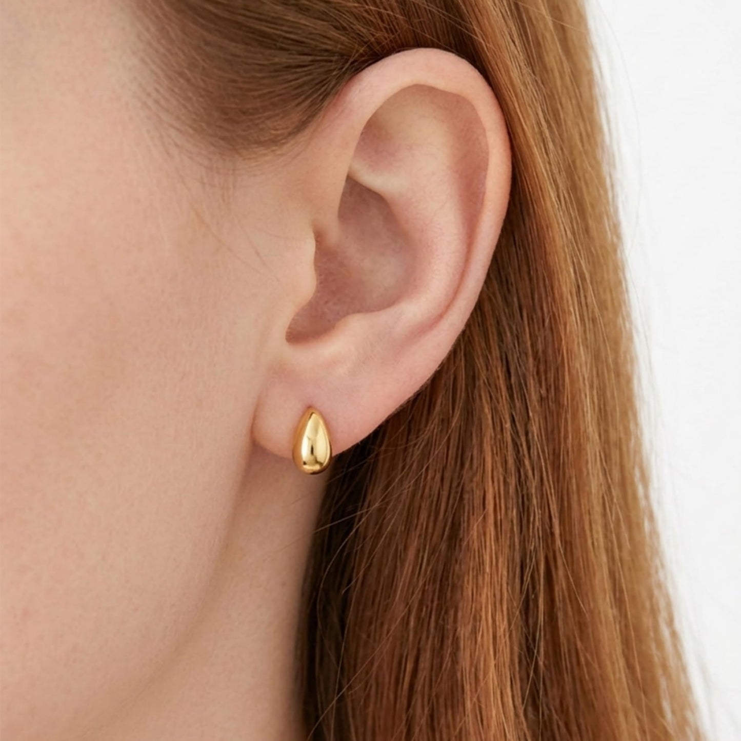 Gold teardrop stud earrings, shiny teardrop discs with small stud backs