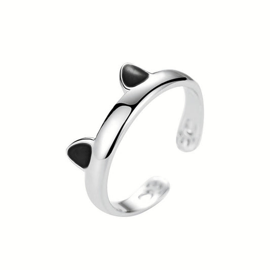Silver-toned cat paw ring with black enamel accents, open band design