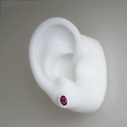 CZ halo stud earring, oval ruby red gem with silver crystal surround