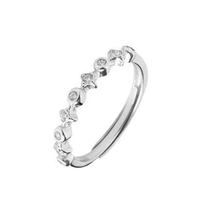 Silver CZ ring with linked star bezels and round CZ stones, full band view