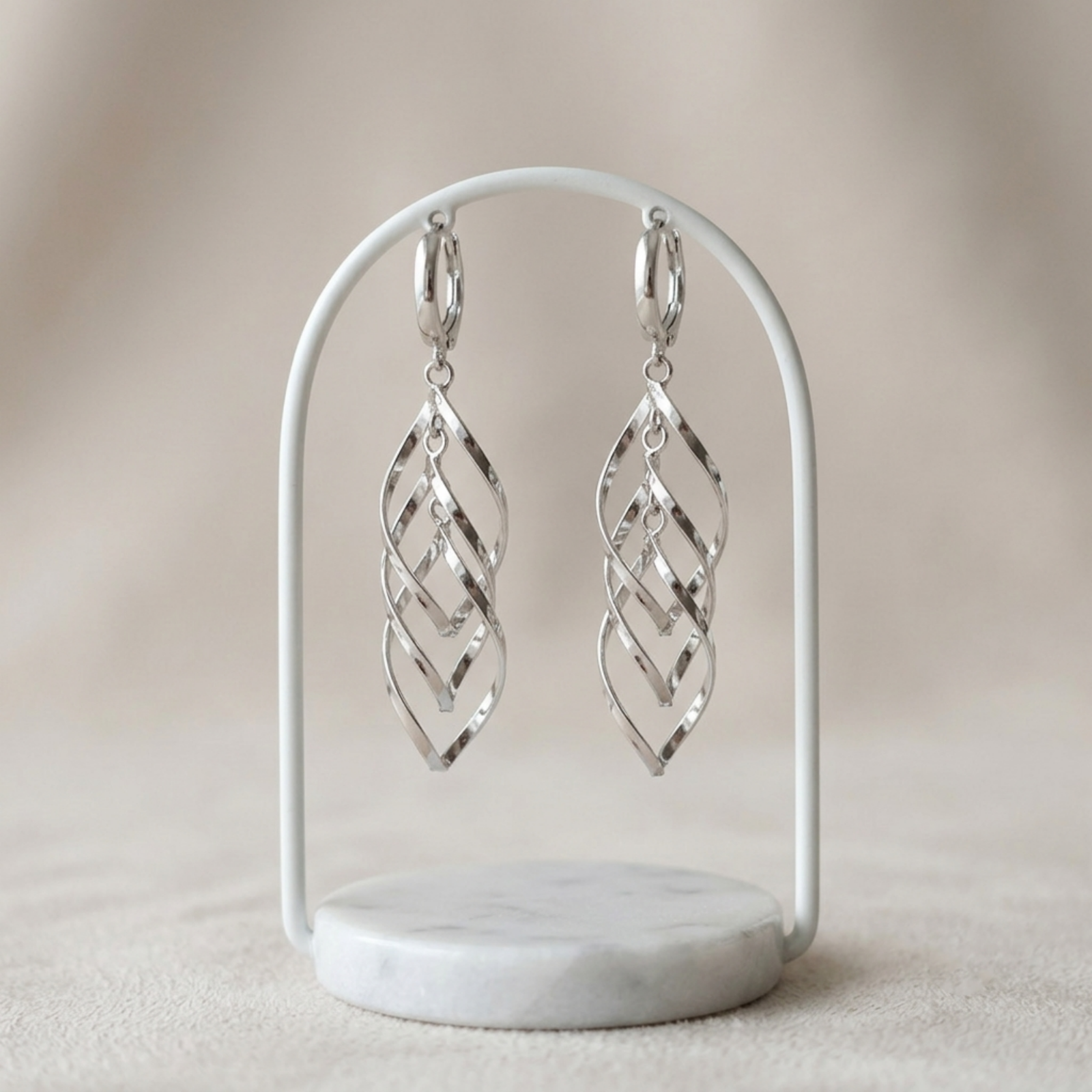 Pair of silver-tone long dangling hoop earrings with geometric lattice drops