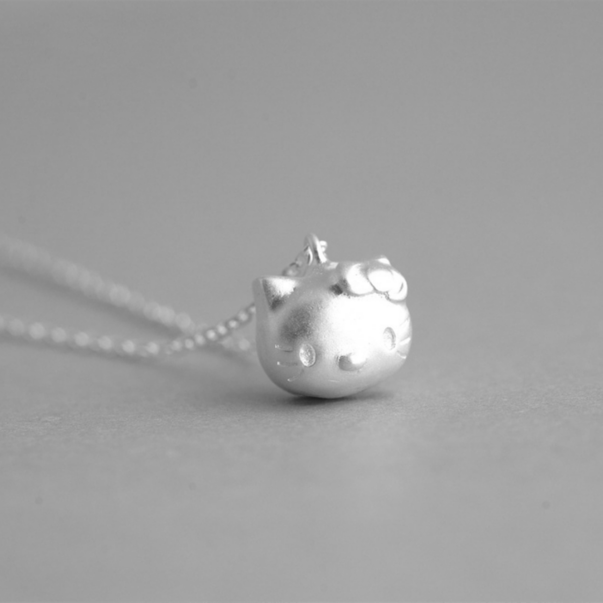 Sterling Silver Hello Kitty Necklace with Jingle Bell Charm - sugarkittenlondon