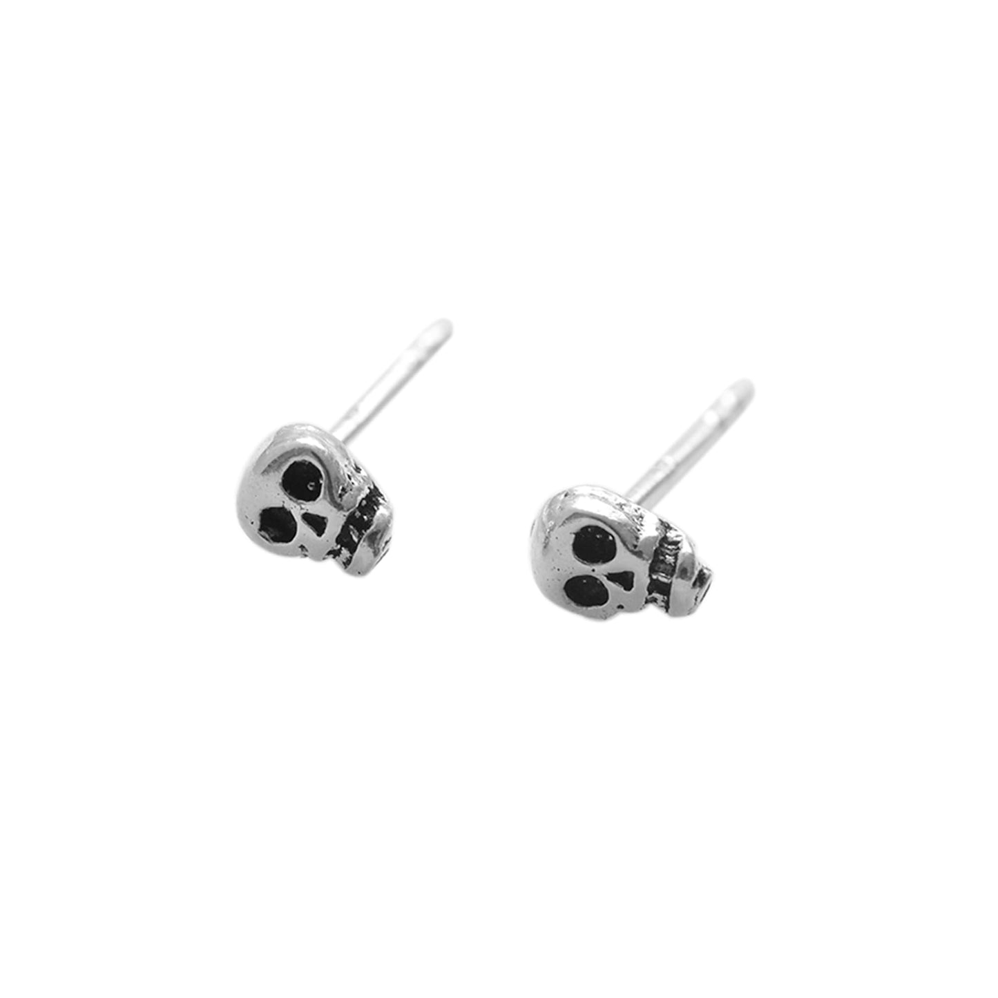 Mini gothic skull stud earrings with black-eyed skull faces, silver-tone posts