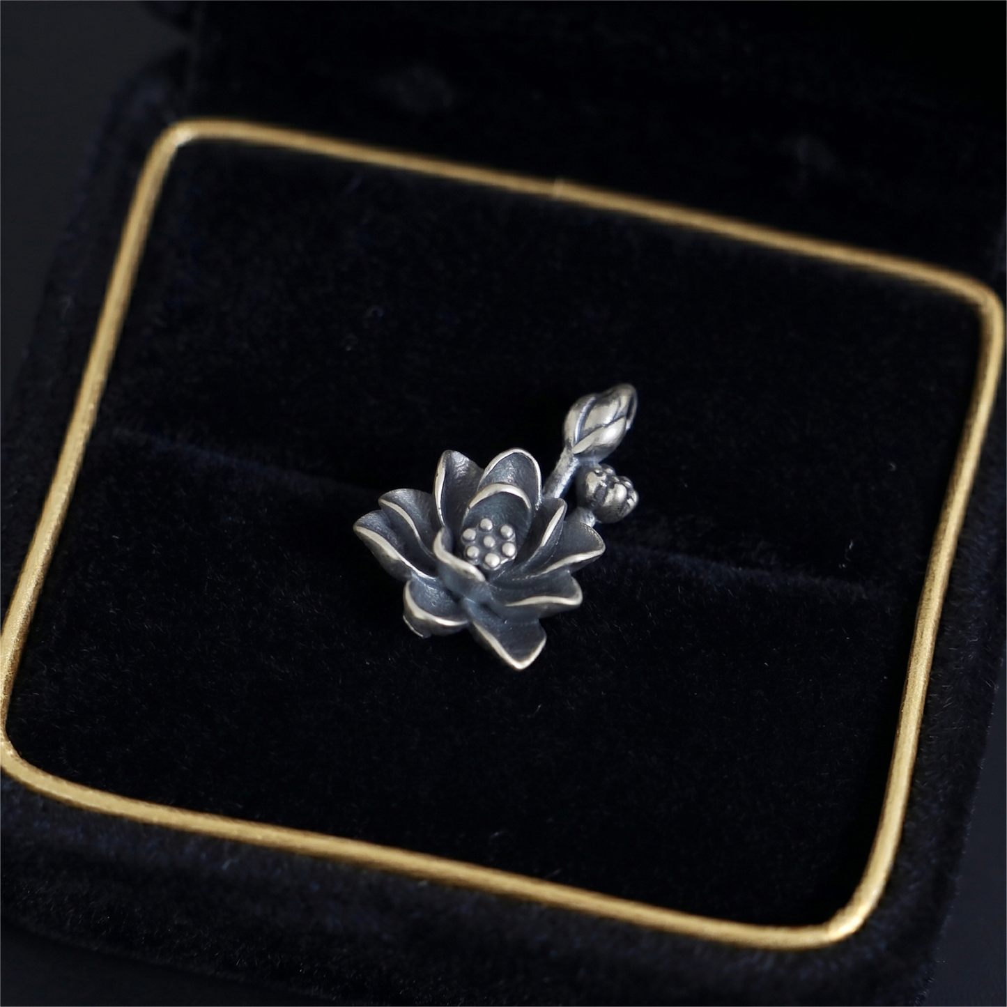 Oxidised 3D lotus charm pendant, dark petals and bead-textured center
