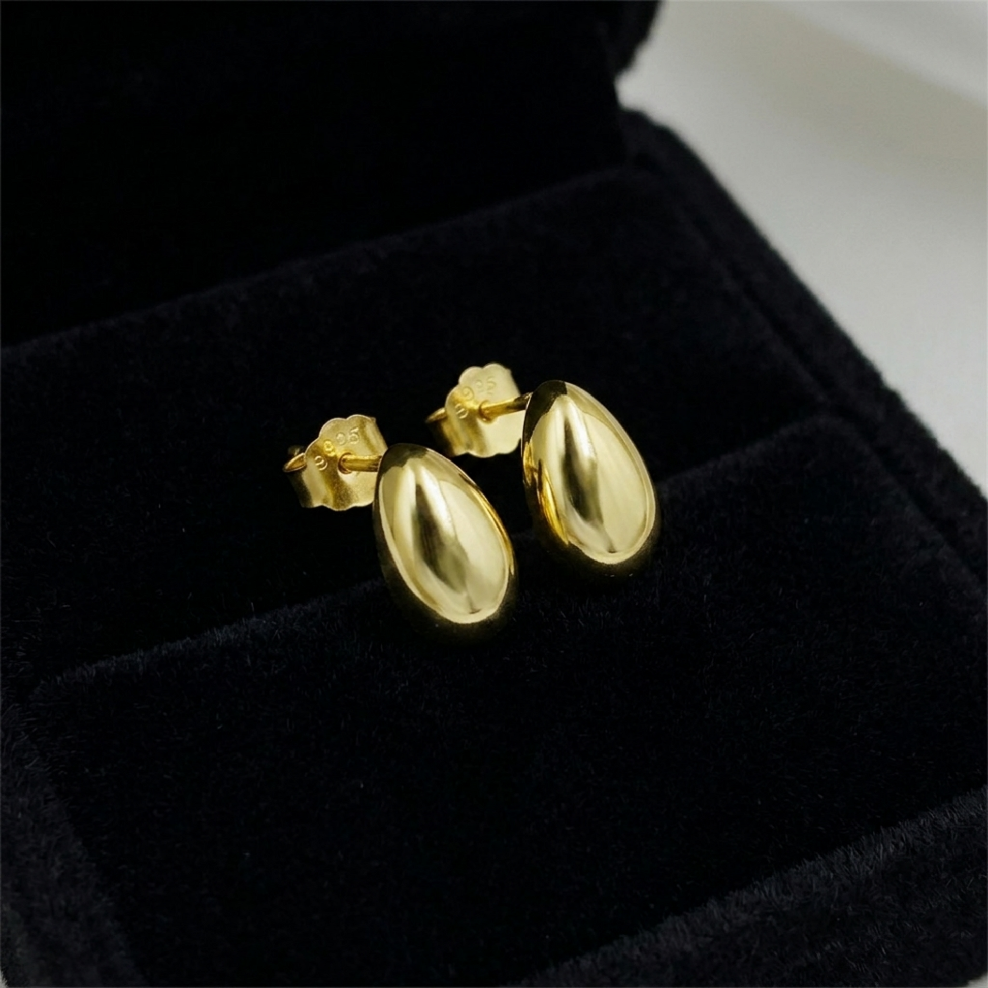 Gold teardrop stud earrings, glossy teardrop shape with post backs