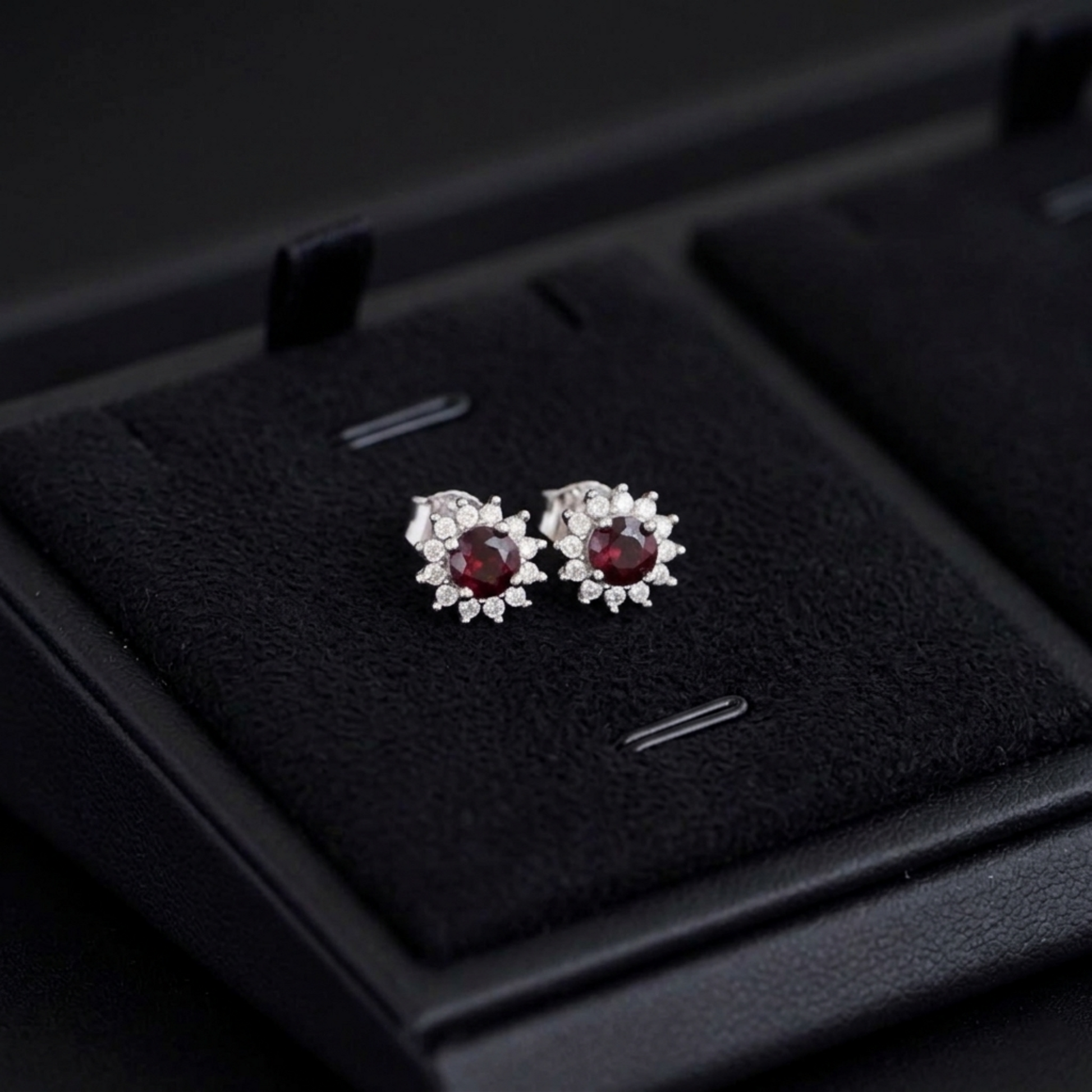 Red round gemstone stud earrings with halo cluster prongs