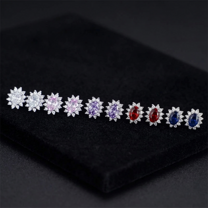 Cluster earrings with oval gemstones in pink, purple, red and blue, halo of white stones