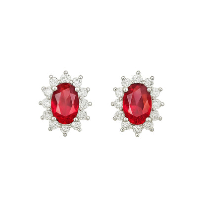 Oval ruby cluster earrings with halo of small round white stones, red gemstone, white metal