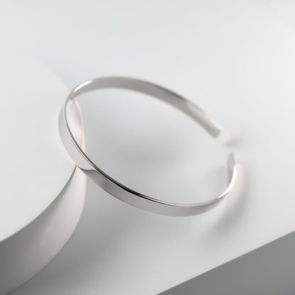 Polished cuff bangle, sleek silver band with slightly open cuff opening