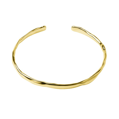 Hammered 18K gold cuff bracelet with smooth curved open band