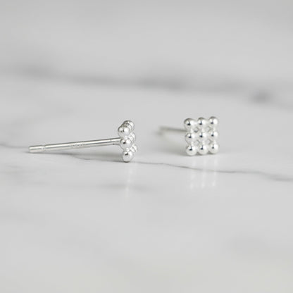 Mini geometric cube stud earrings, close-up with spherical bead details and post