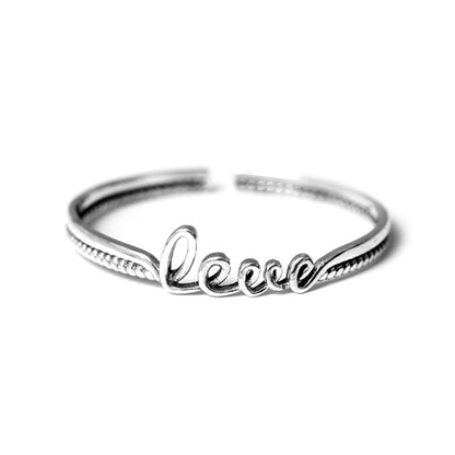 Love Knot Rope Cuff bracelet with 'Love' script and ridged edge, silver-tone
