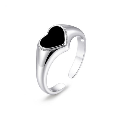 Silver-tone wishbone ring with black heart enamel center and sparkling border
