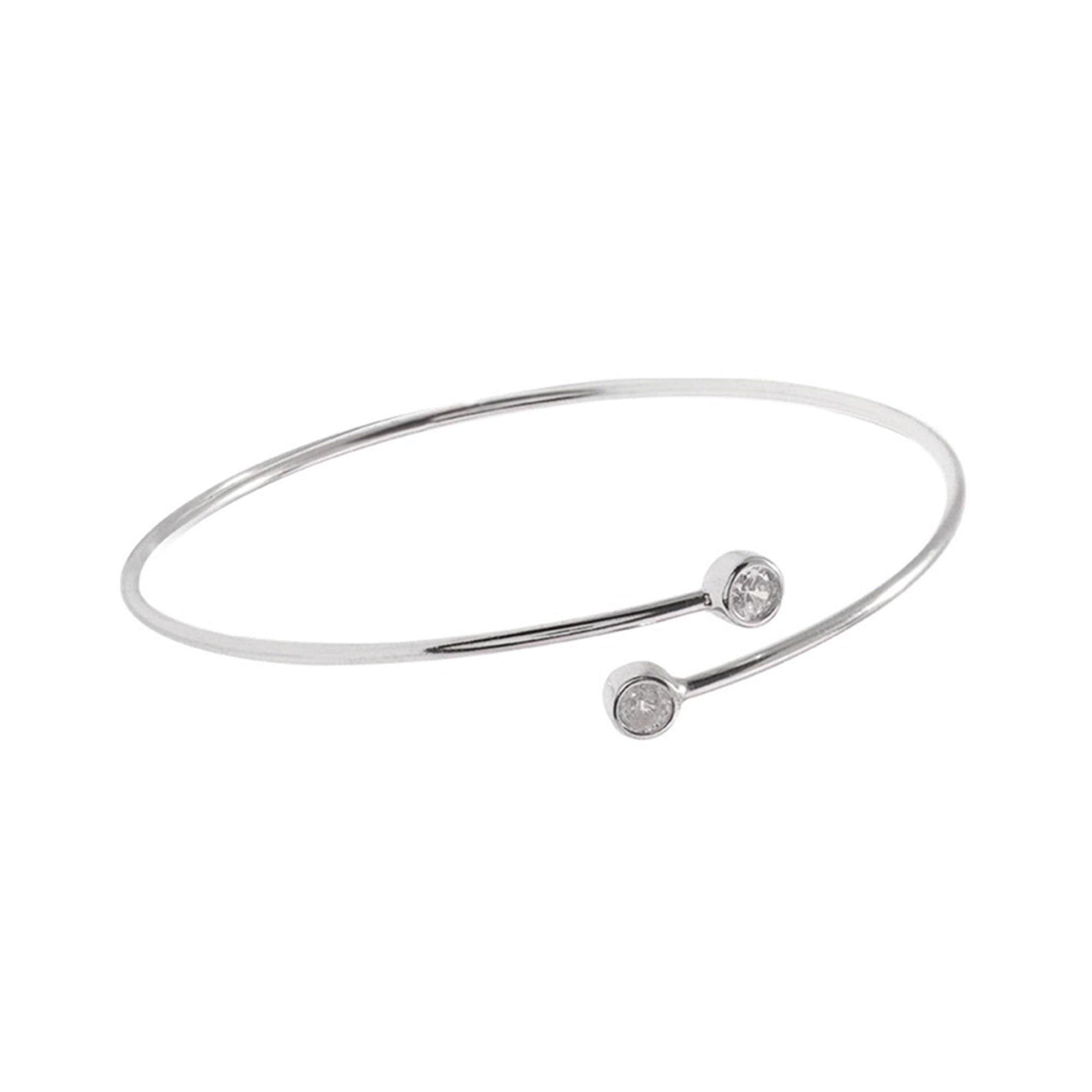 Bezel CZ torque bangle in silver tone with two round clear stones