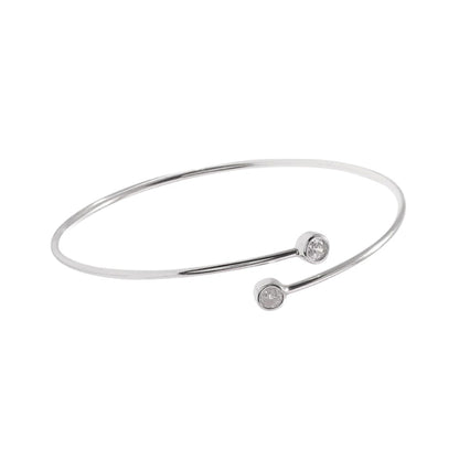 Bezel CZ torque bangle in silver tone with two round clear stones
