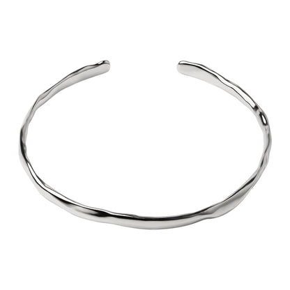 Hammered silver cuff bracelet with smooth, curved open band