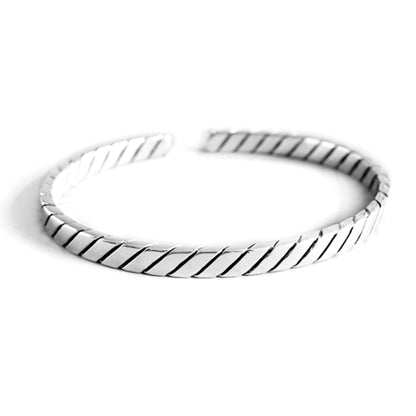 Oxidised rope cuff bangle with interlocking ridged metal strip design