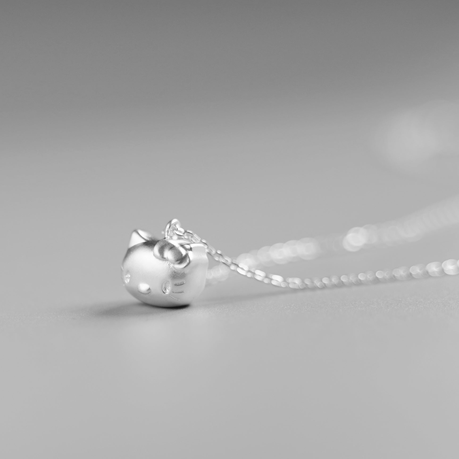 Sterling Silver Hello Kitty Necklace with Jingle Bell Charm - sugarkittenlondon