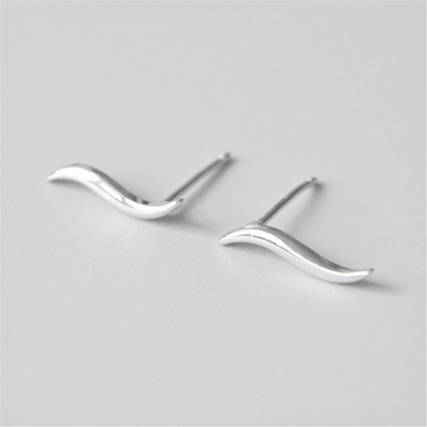 Wavy vine climber stud earrings with smooth, flowing wave contours and posts