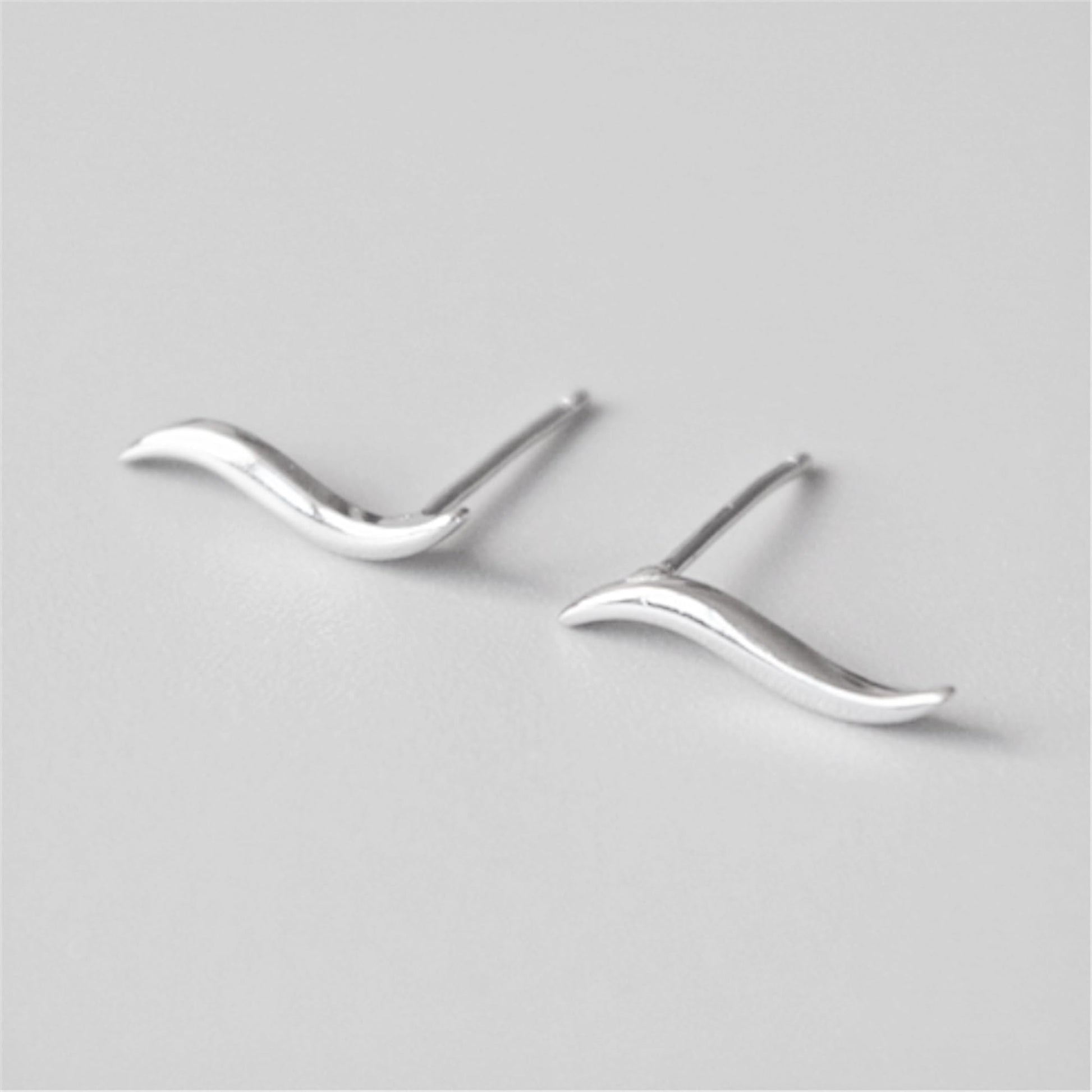 Wavy vine climber stud earrings with smooth, flowing wave contours and posts