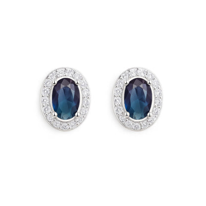 Dark blue oval CZ halo stud earrings with a clear pavé border