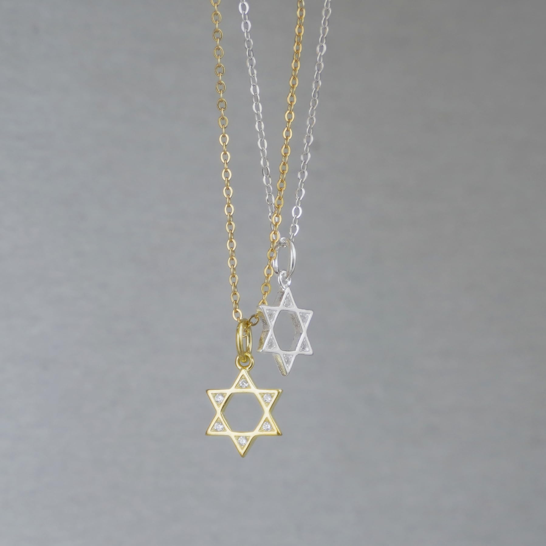 3-Tone Mixed Link Chain with star-shaped charms in gold-tone and silver-tone