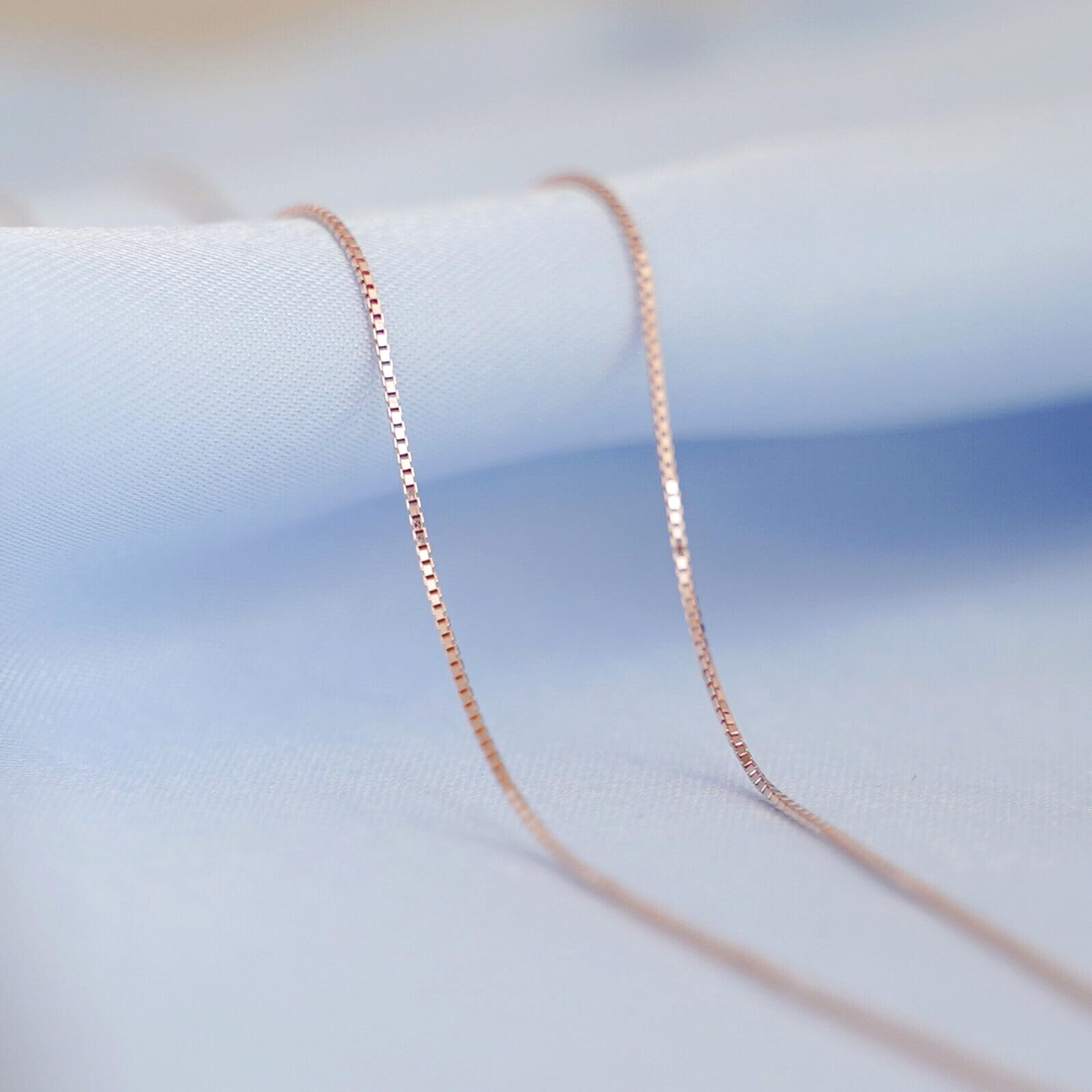 Minimalist Box Chain in Rose Gold tone, close-up of curved links