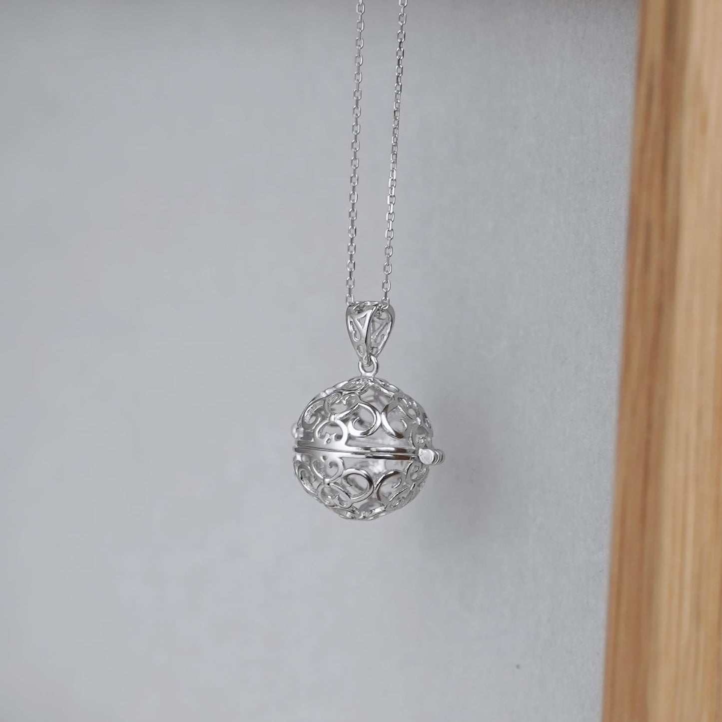 Rhodium curb chain necklace with filigree round ball pendant