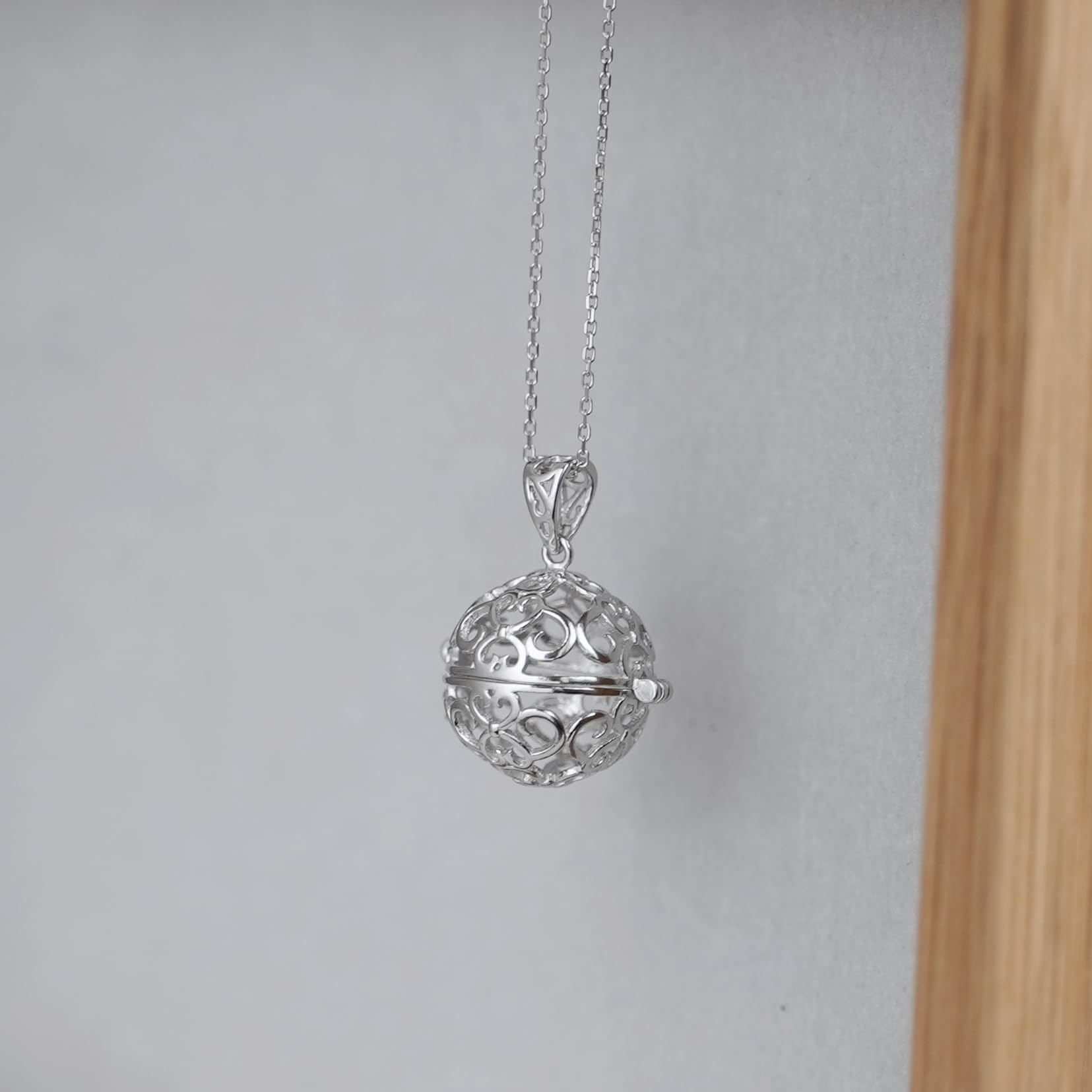 Rhodium curb chain necklace with filigree round ball pendant