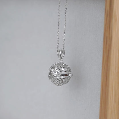 Rhodium curb chain necklace with filigree round ball pendant