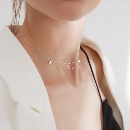 Mini Moon & Star CZ Choker worn: crescent moon center with star charms