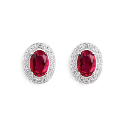 Ruby red oval CZ halo stud earrings with clear pavé surround in silver-tone
