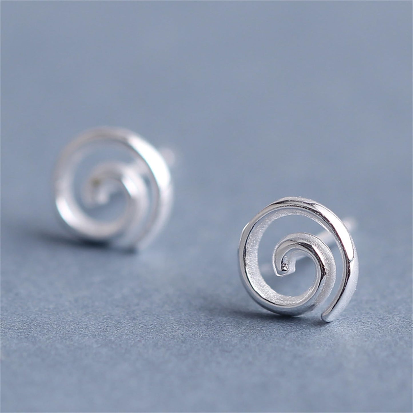 Spiral Swirl Studs earrings, angled view of round spiral swirl detail