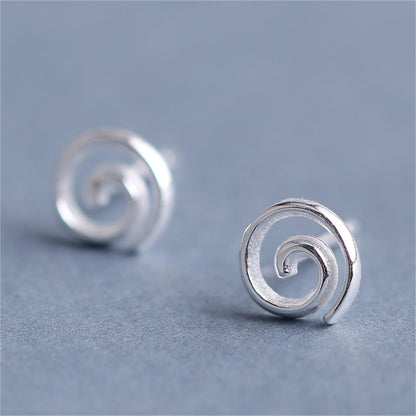 Spiral Swirl Studs earrings, angled view of round spiral swirl detail