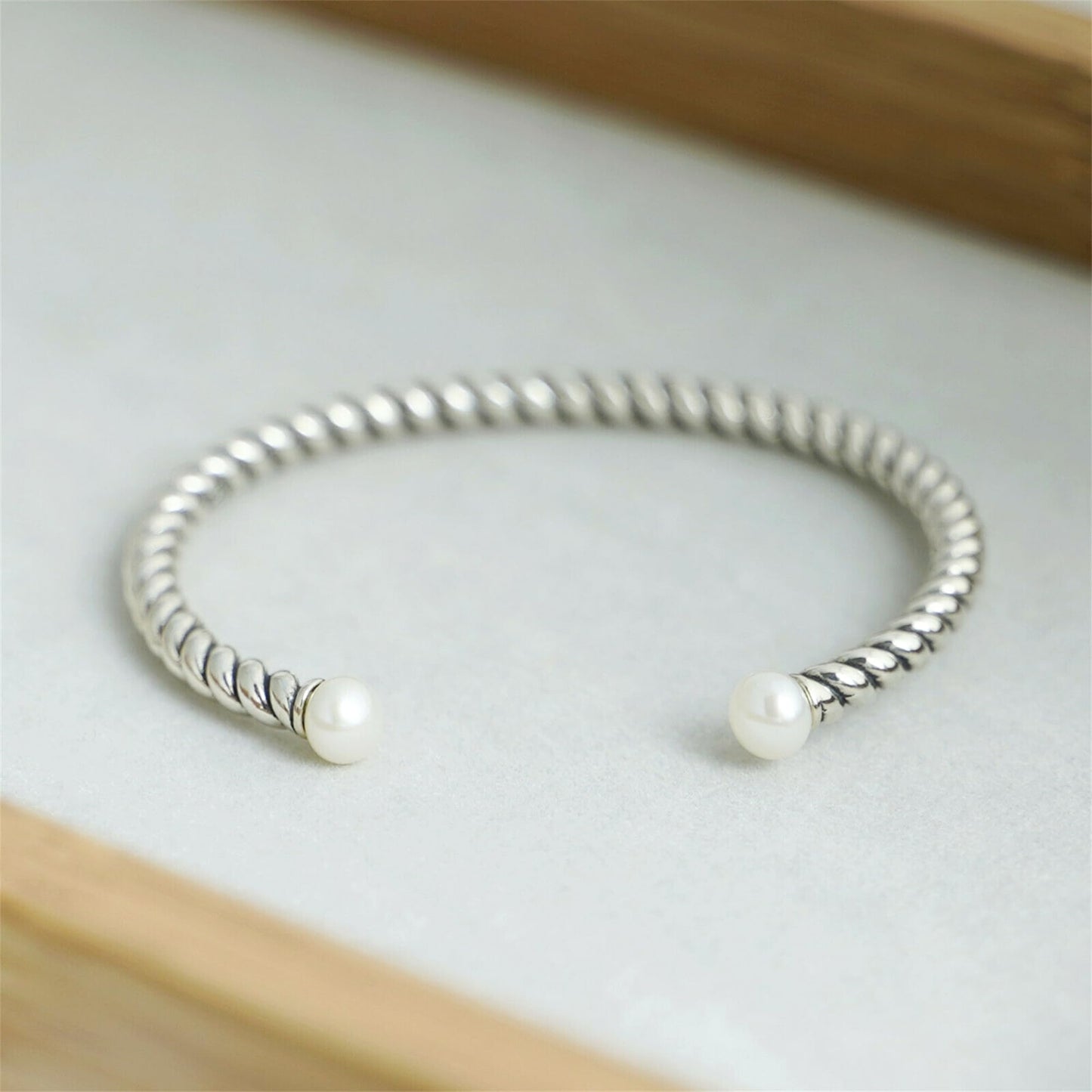 Pearl Twisted Torque Bangle, twin white pearl ends on twisted silver cuff