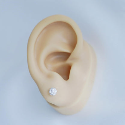 Dandelion flower stud earring on ear, silver-tone crystal bloom