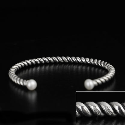 Pearl Twisted Torque Bangle with silver twisted texture and two white pearl ends