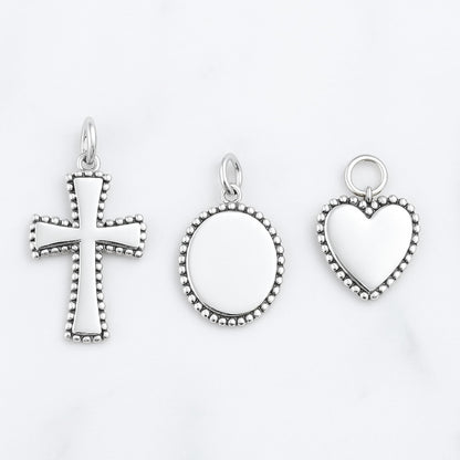 Heart charm pendant with beaded border and ring loop, silver tone