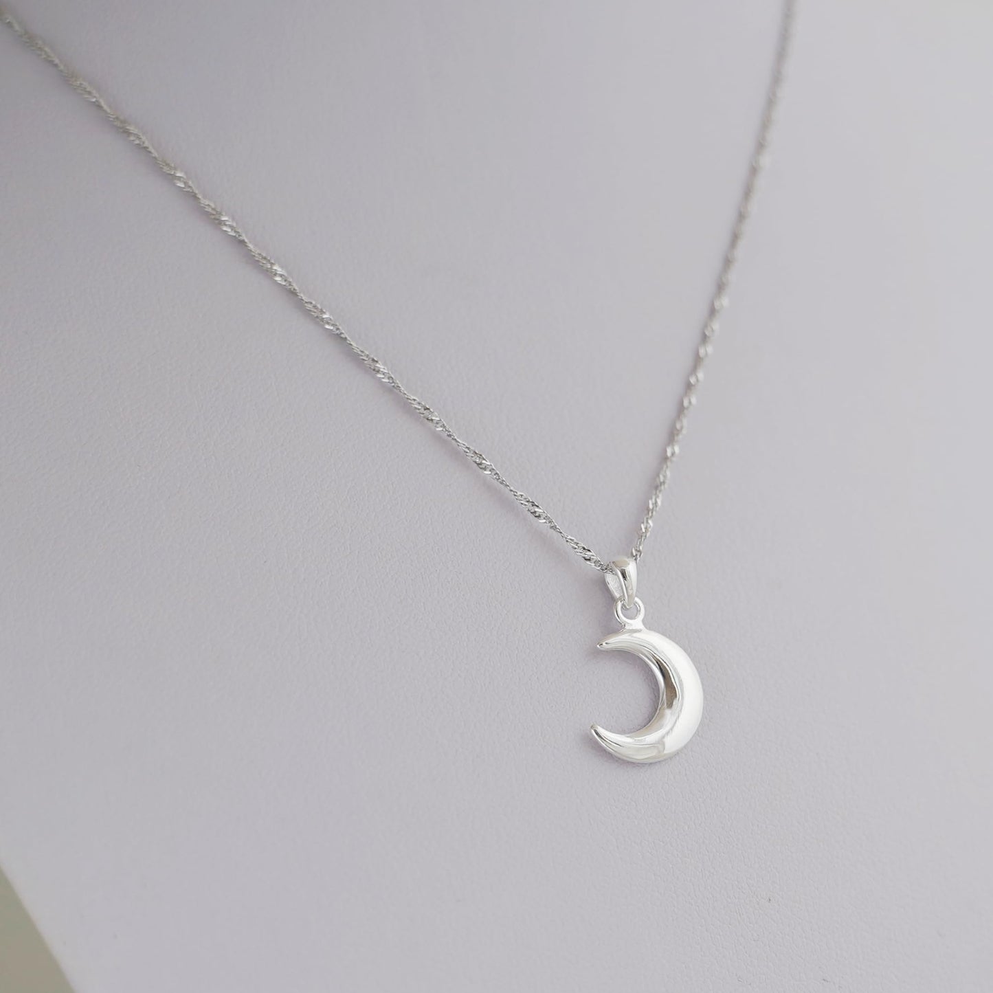 Rhodium twisted chain with crescent moon charm