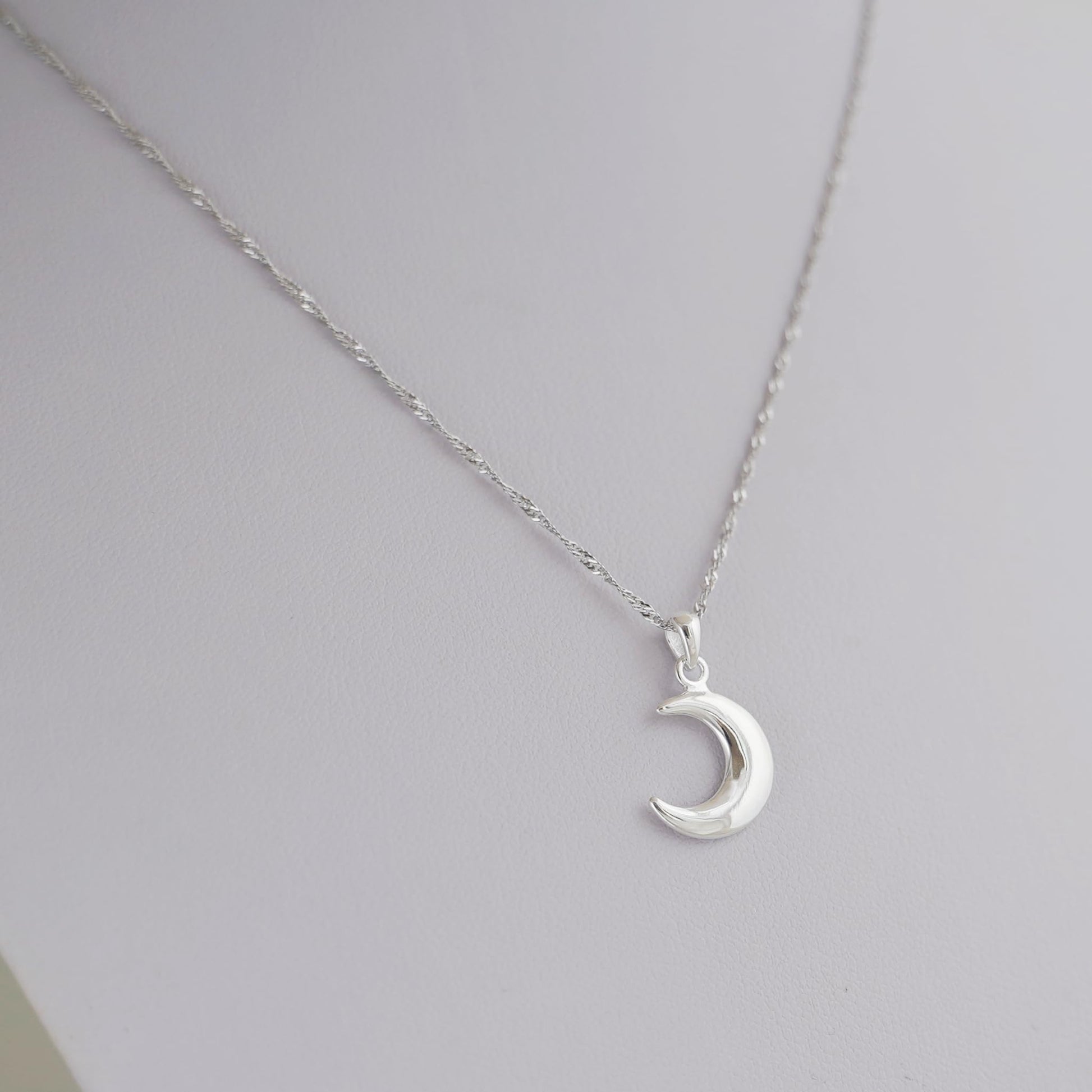 Rhodium twisted chain with crescent moon charm