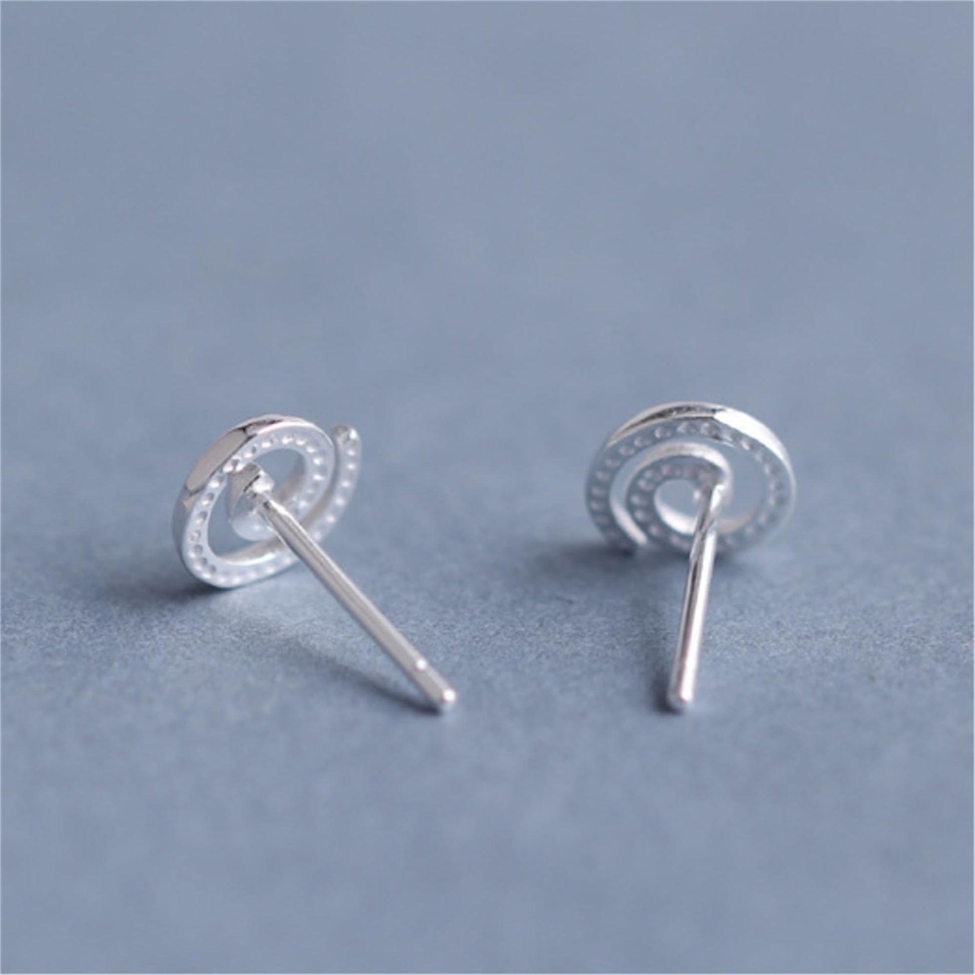 Spiral Swirl Studs earrings showing front swirl and straight post backing