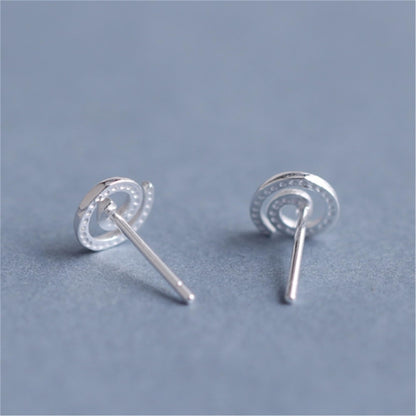 Spiral Swirl Studs earrings showing front swirl and straight post backing