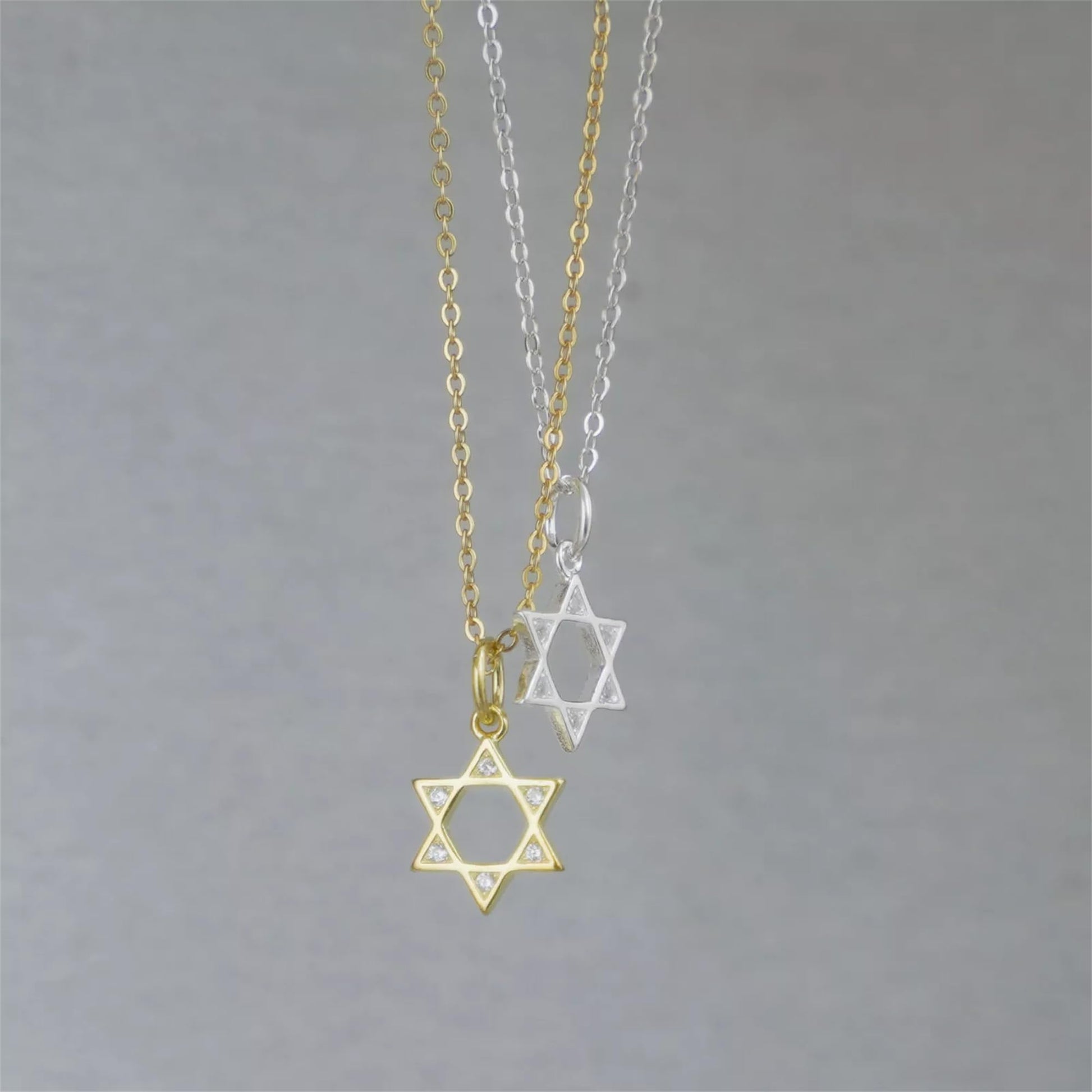 Gold and silver Star of David pendants with matching chain links
