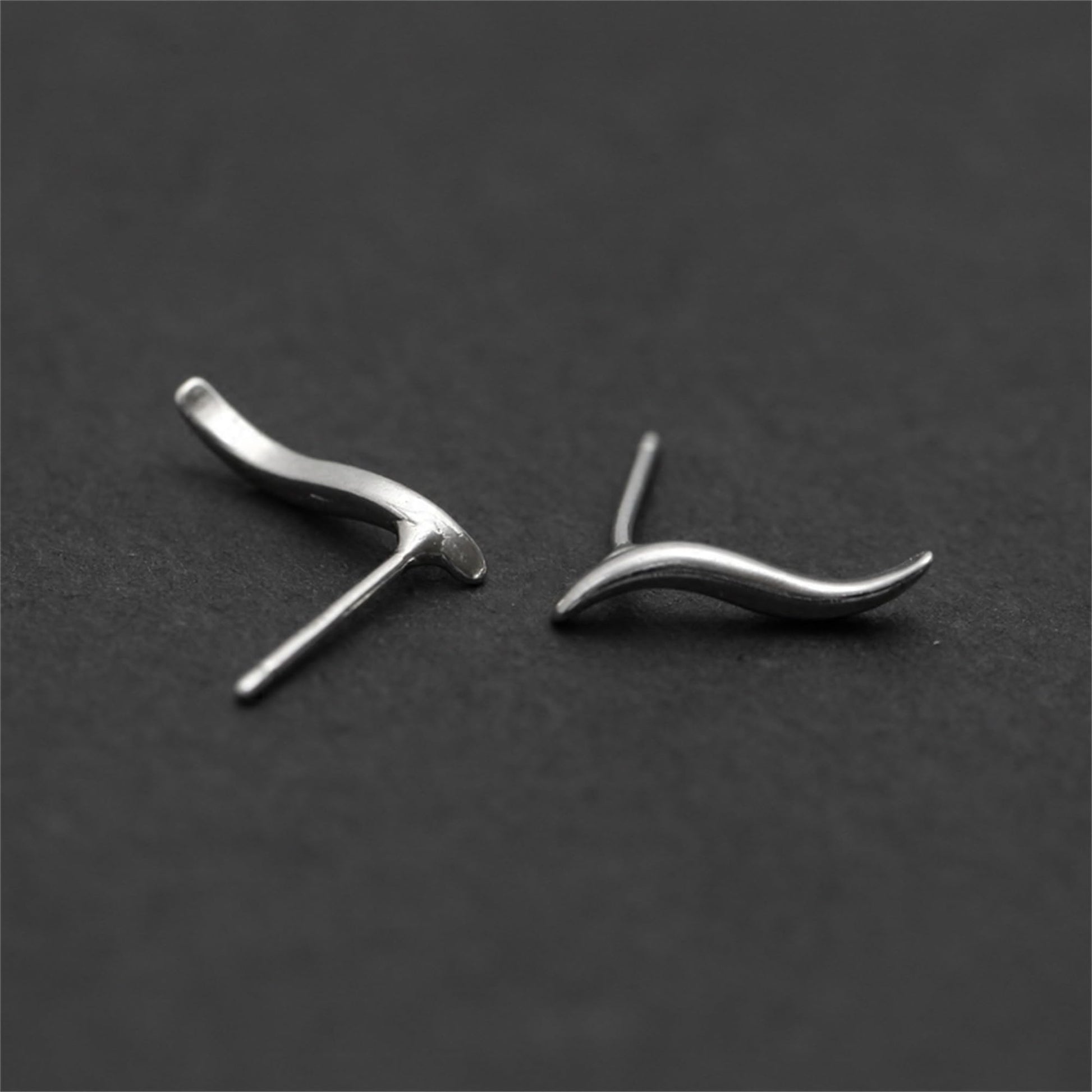Wavy vine climber stud earrings, front view of two curved waves with post details