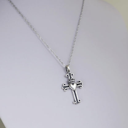 Rhodium twisted chain with metallic cross pendant